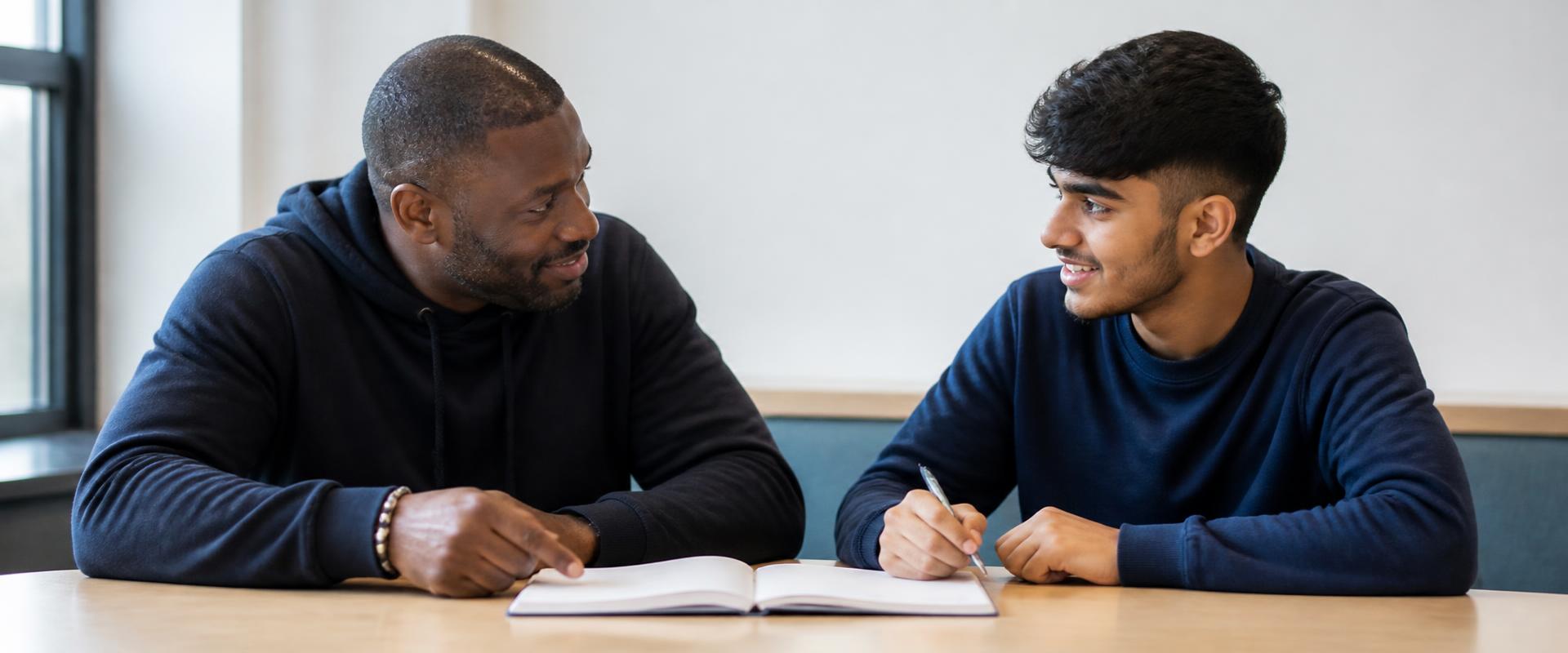 A diverse group talking together in a supportive mentoring session